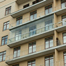 Панорамное безрамное остекление во всю ширину и высоту балкона